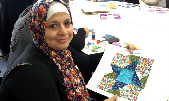 Former refugee with quilt square