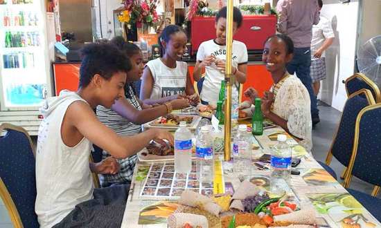 Ethiopian youth enjoy cultural food
