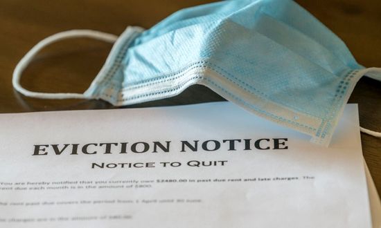 Image of mask and eviction notice